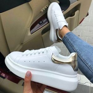 White and Gold Alexander McQueen sneakers
